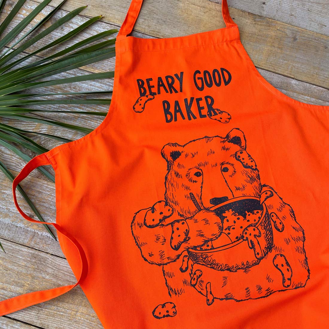 orange apron with baking bear print