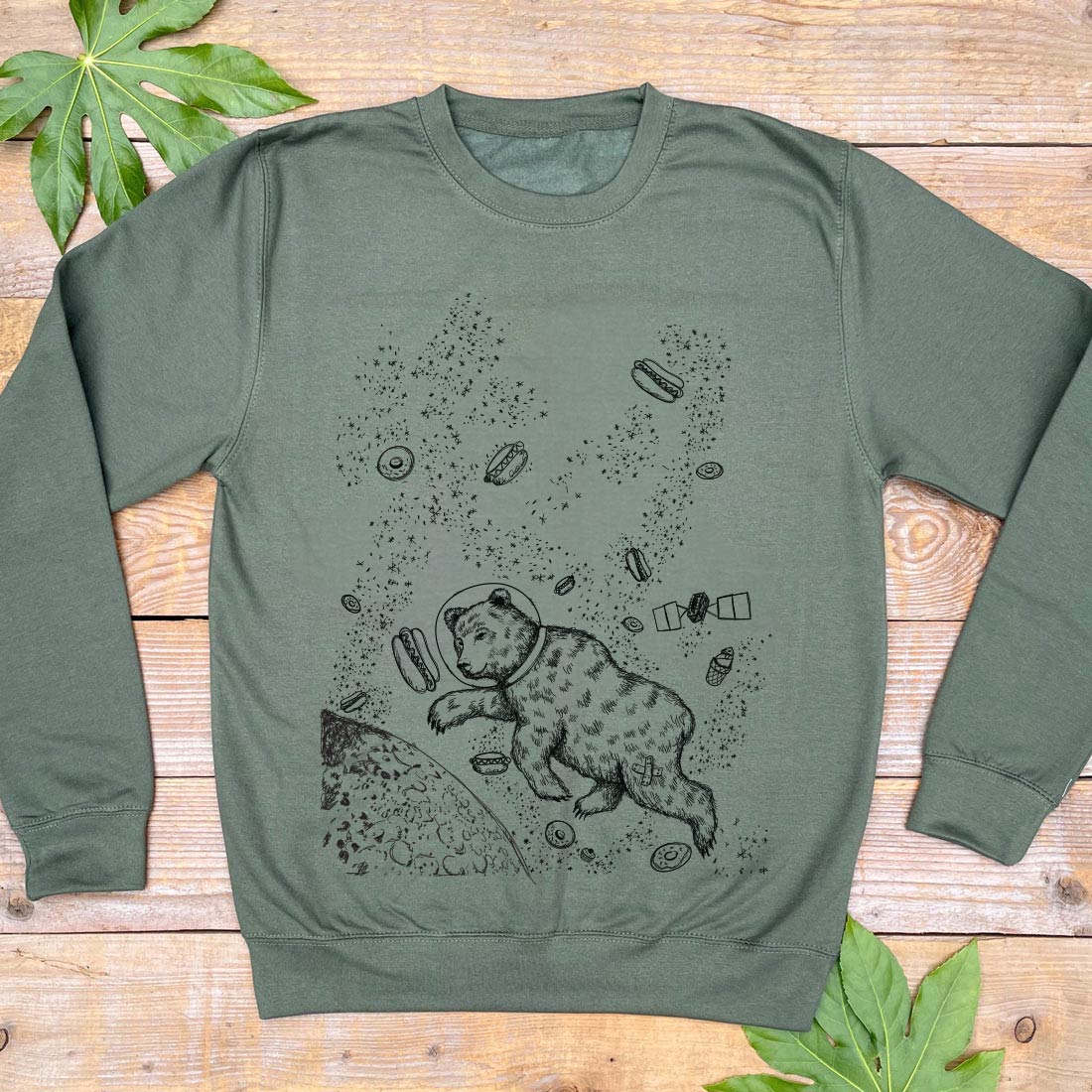 khaki jumper with bear and hot dogs in space