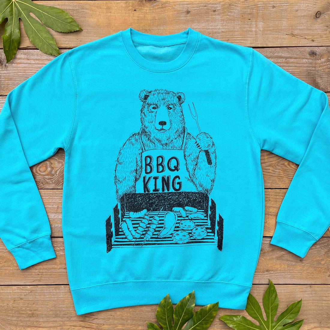 blue jumper with BBQ King on