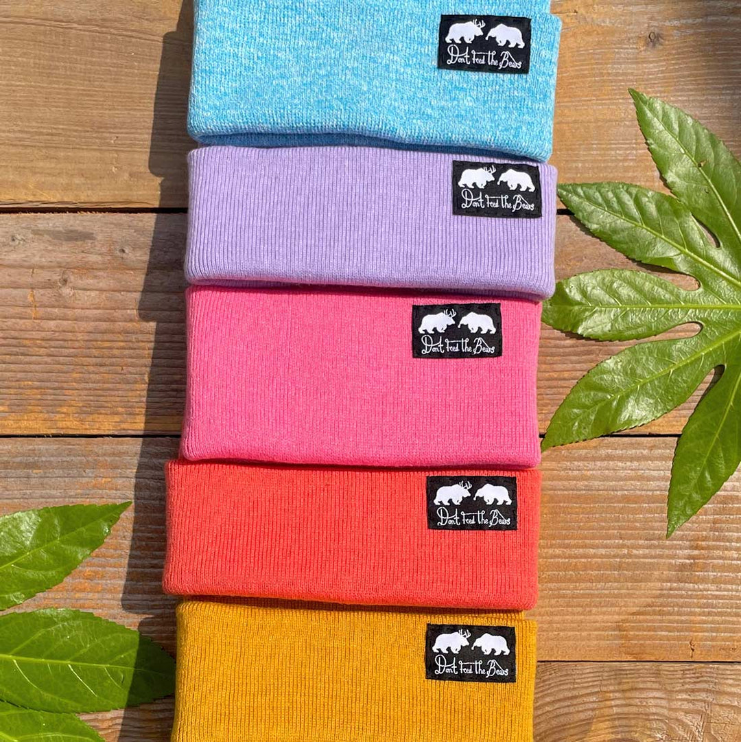 pink and blue beanies