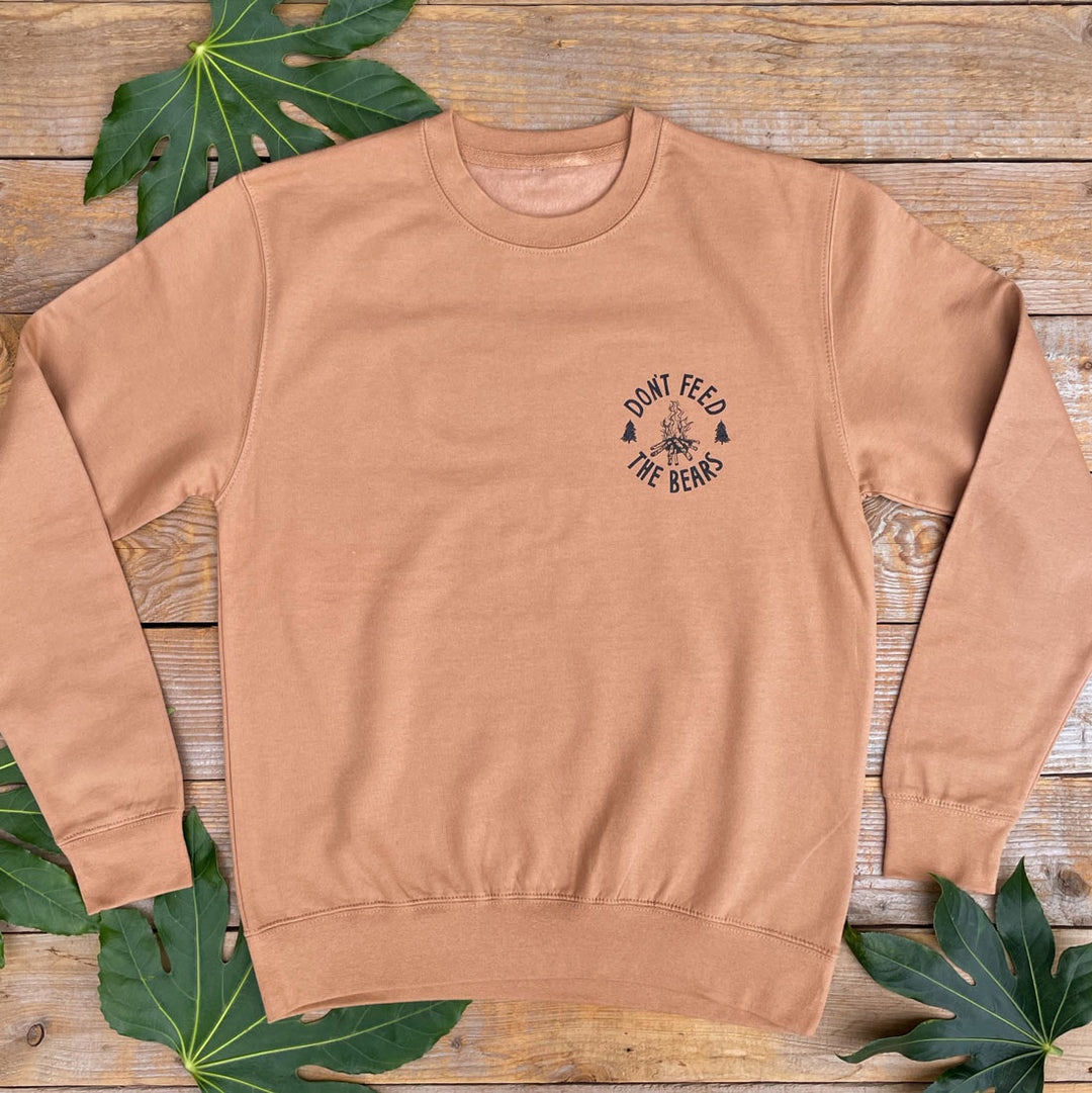 brown jumper with campfire logo