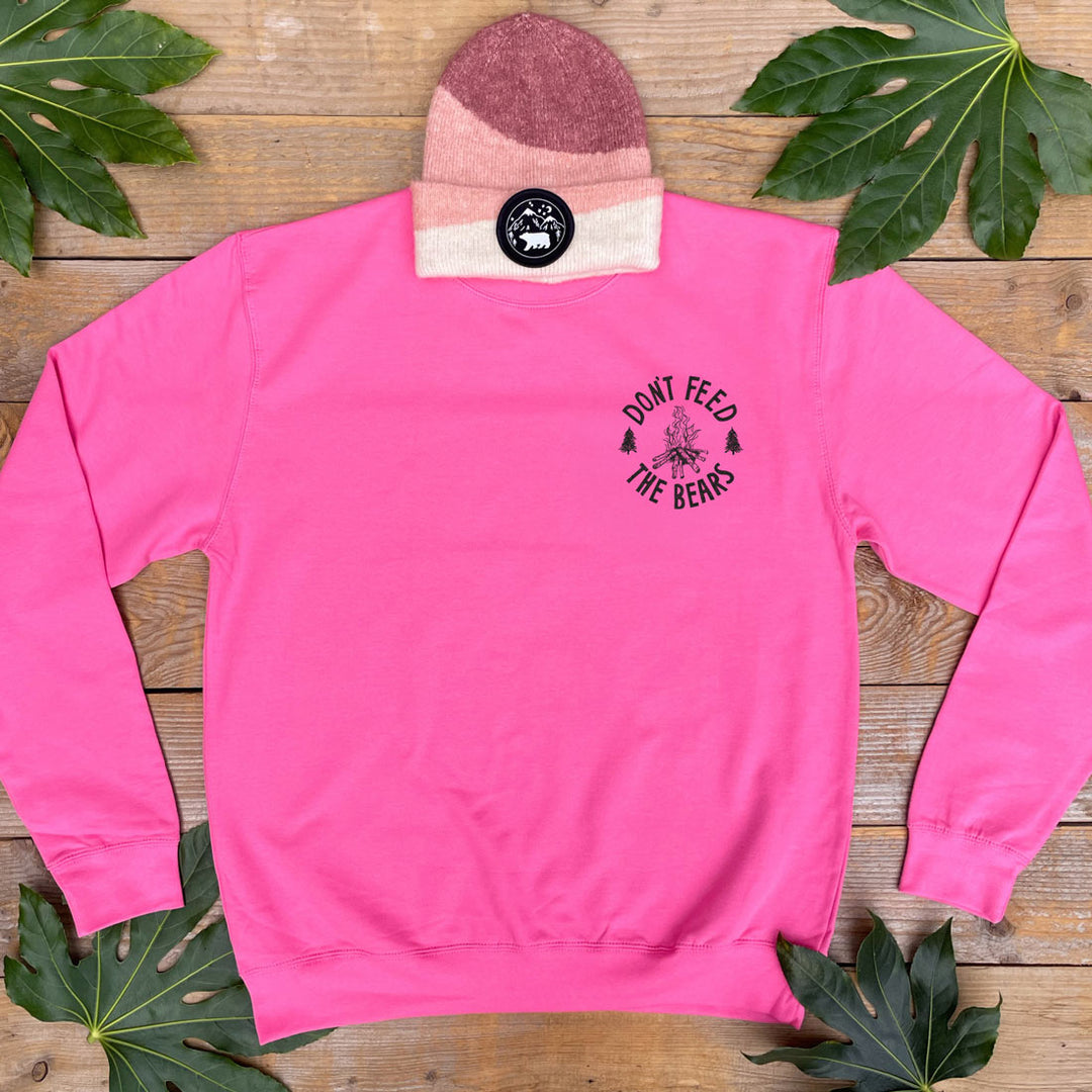 pink jumper with campfire design