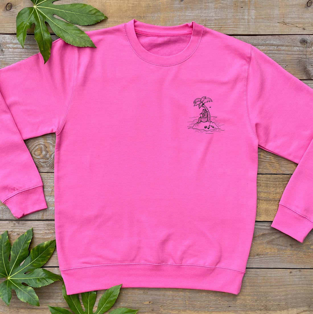 BEAR ON AN ISLAND WITH PALM TREE PINK JUMPER