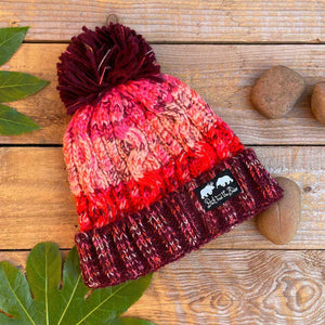 red and pink bobble hat