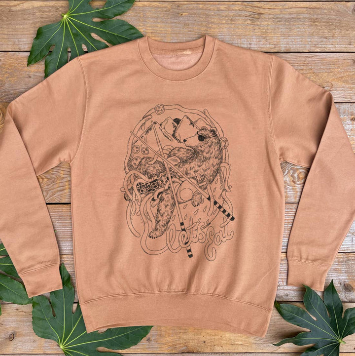 brown jumper with bear and noodles design
