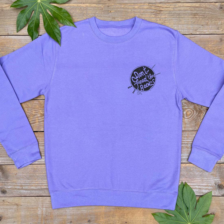purple sweater with noodle logo