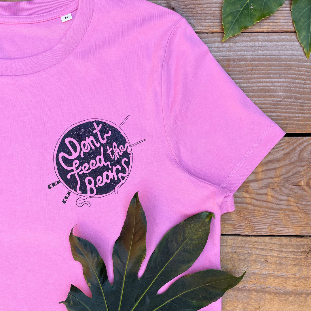 pink tee with noodles logo