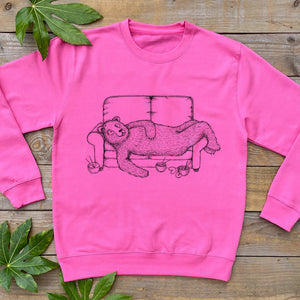 PINK JUMPER WITH BEAR ON A SOFA