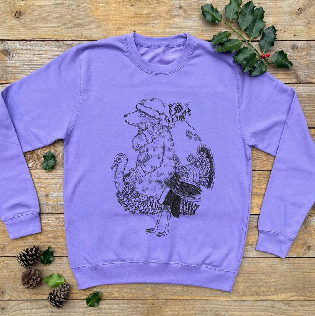 purple jumper with bear riding a turkey
