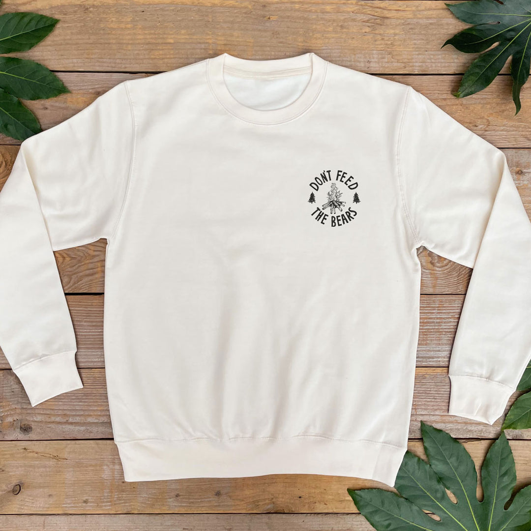jumper with campfire and text