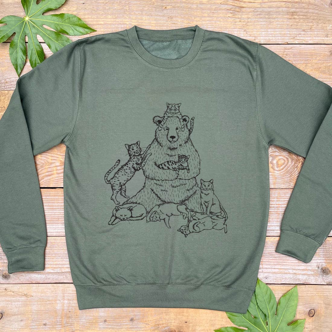 khaki green jumper with bear and cats