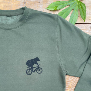 bear riding bicycle sweater