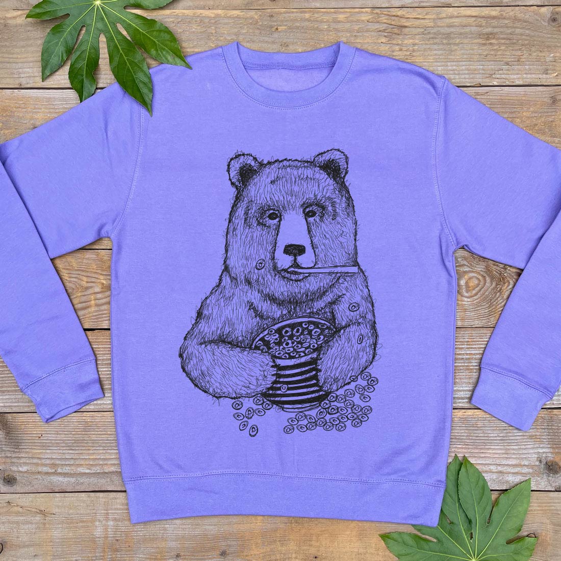 purple jumper with bear eating cereals