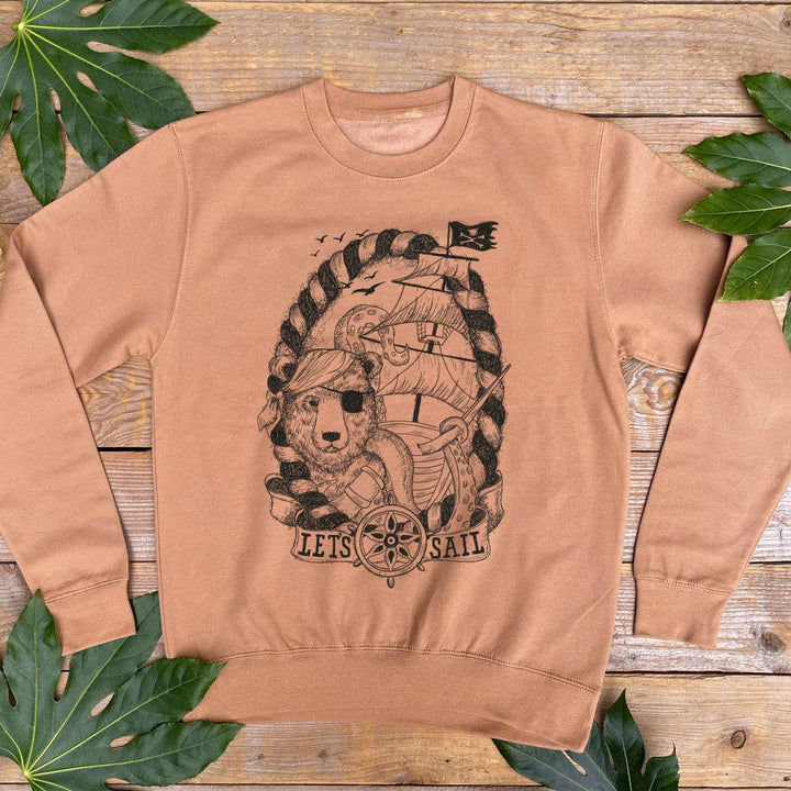 brown jumper with pirate bear design