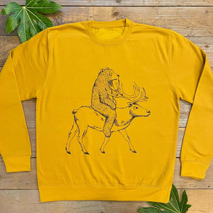 bear riding reindeer yellow jumper