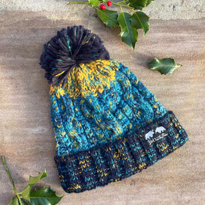 blue, teal and mustard bobble hat