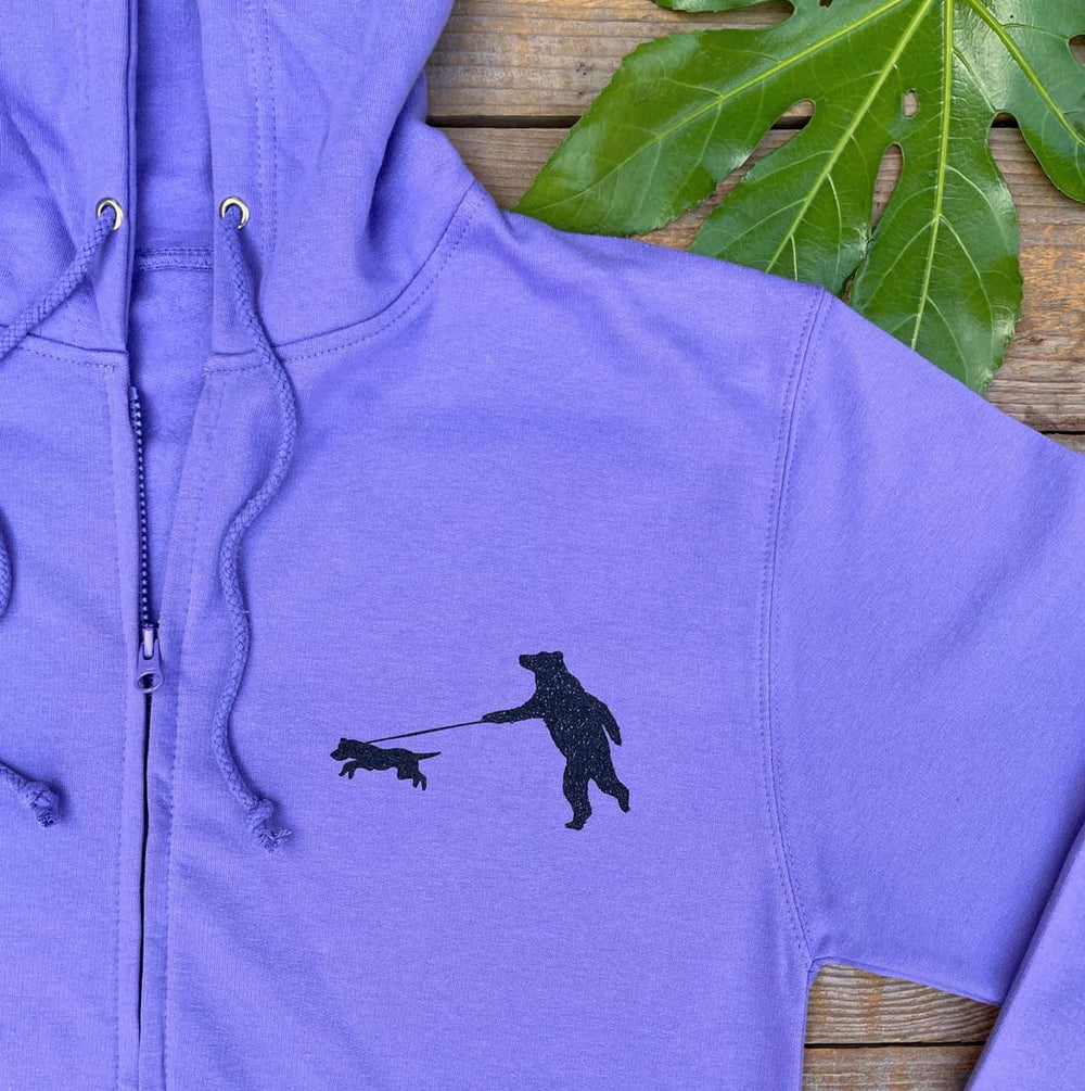 purple hoodie with bear walking dog