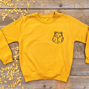 bear reading book yellow jumper