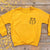 bear reading book yellow jumper